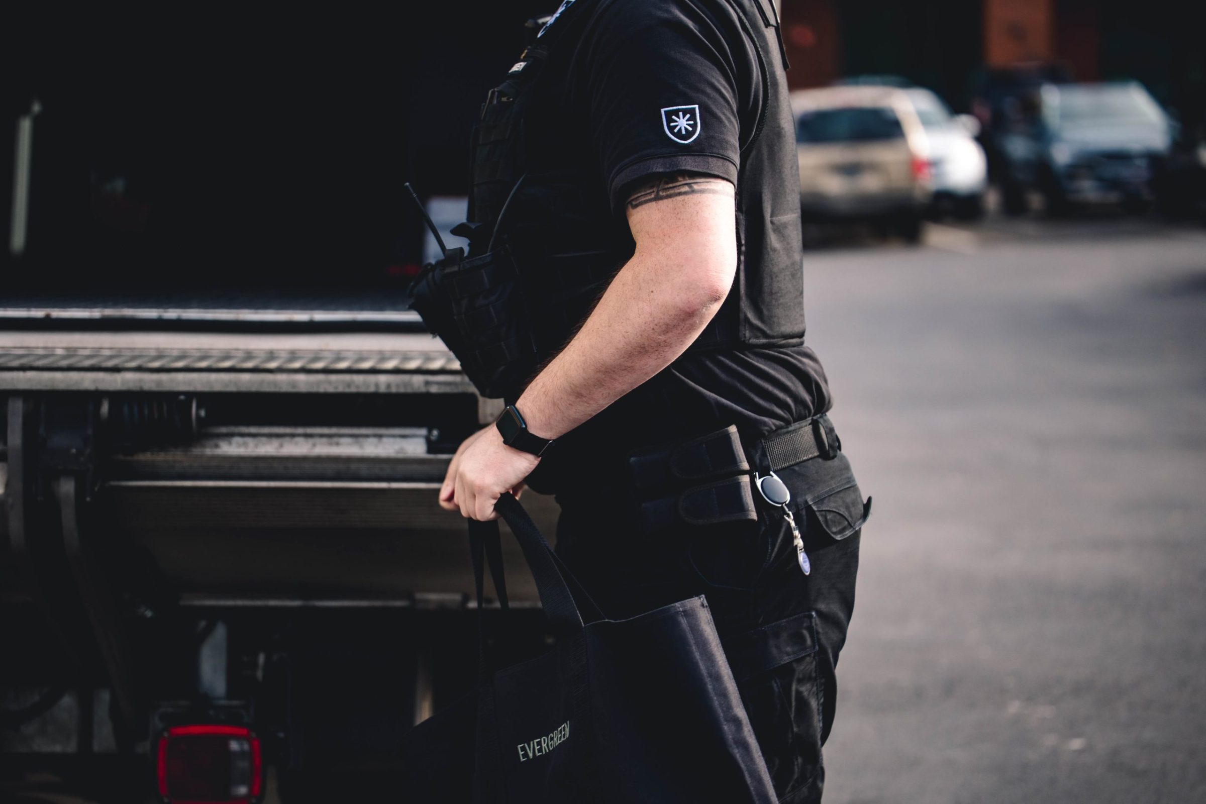 Evergreen Armored employee behind truck