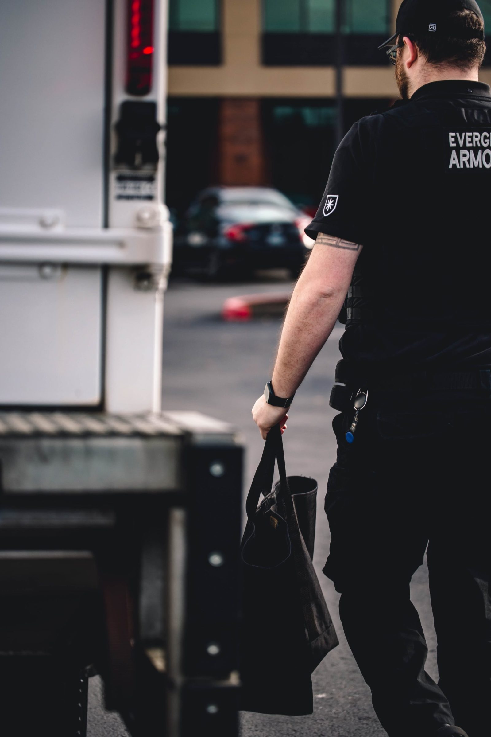 Evergreen Armored employee carrying bag