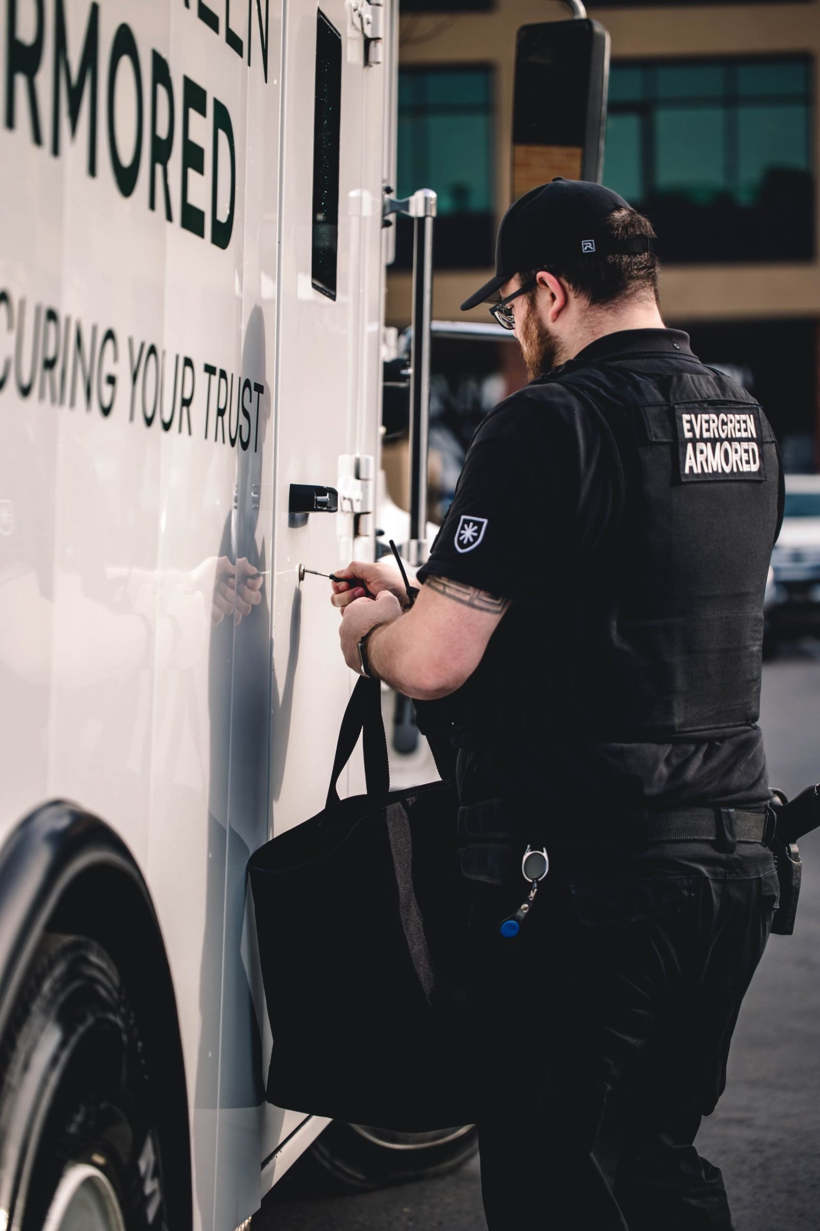 Evergreen Armored employee unlocking truck